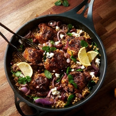Chicken cutlets with farro, spinach, lemon and olives