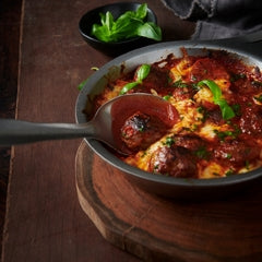 Homemade beef and pork meatballs with tomato sauce and mozzarella