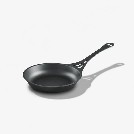 Solidteknics AUS-ION 24cm wrought iron frypan with long vented handle on a light grey background